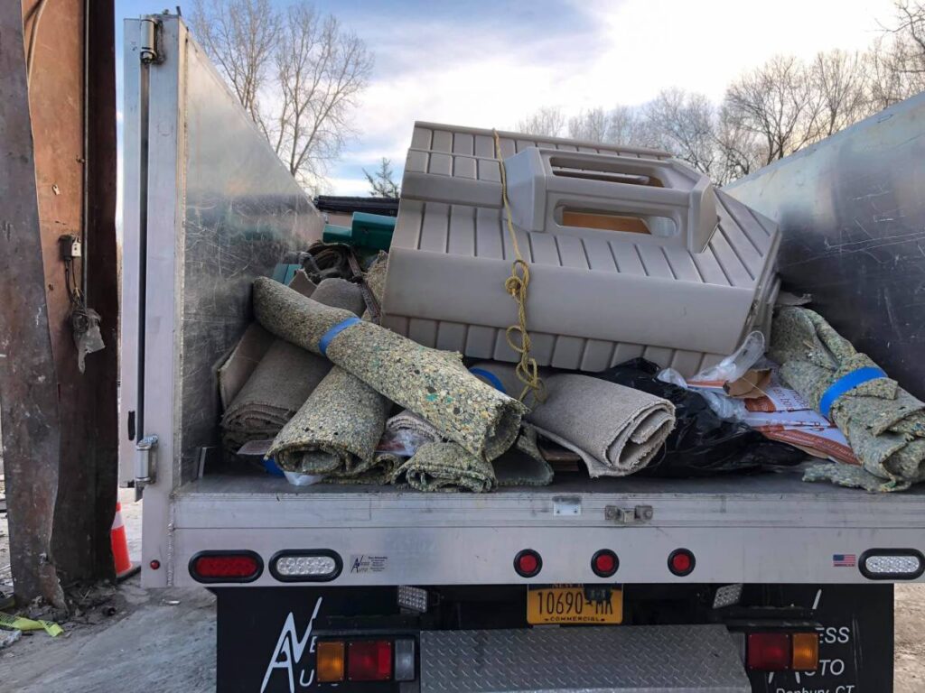 back of a junk pros truck filled with junk from removal in dutchess county