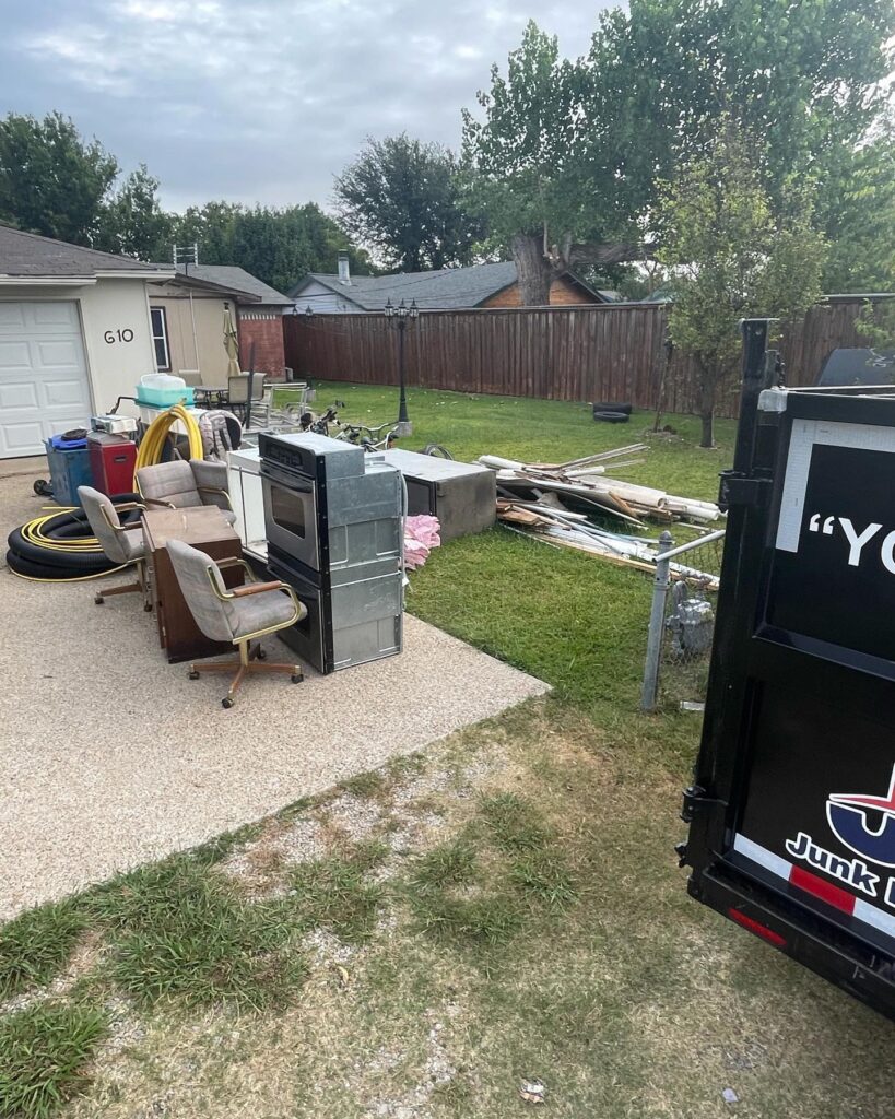 junk on driveway from house cleanout