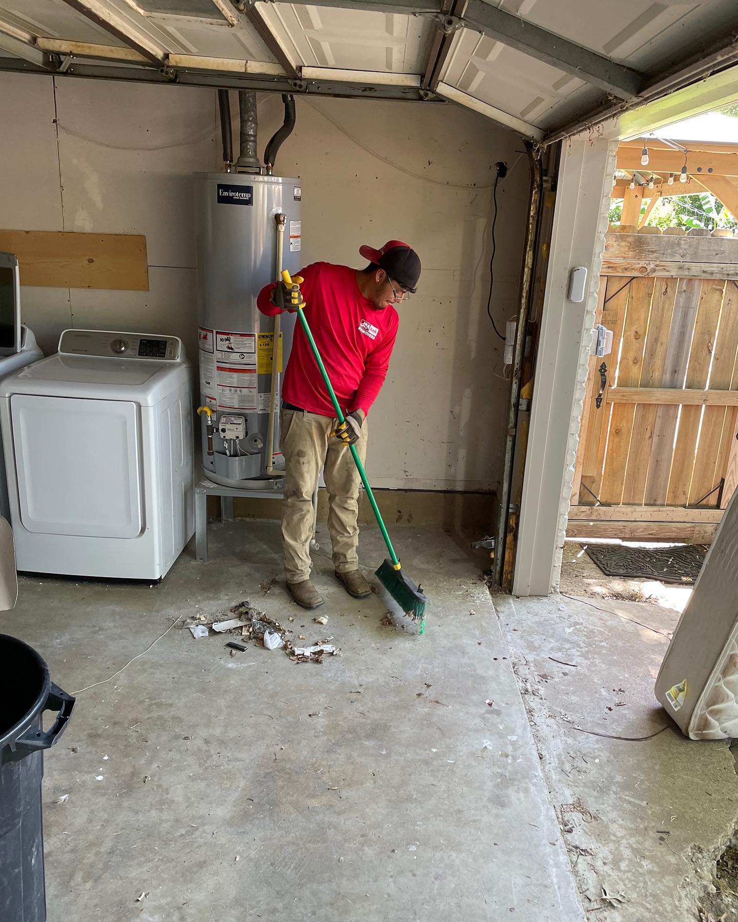 sweeping up a garage after junk removal
