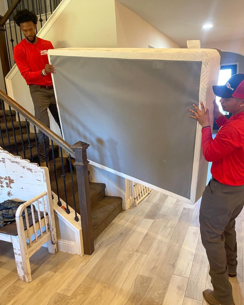 removing a mattress down the stairs