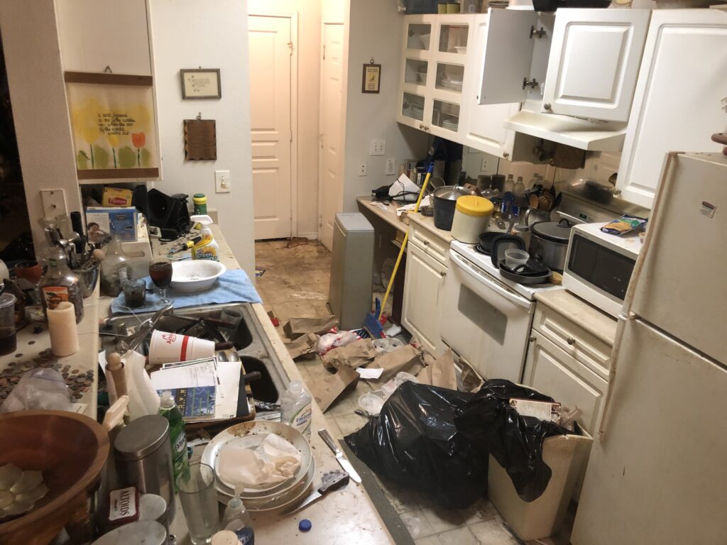 Hoarder kitchen full of trash and clutter
