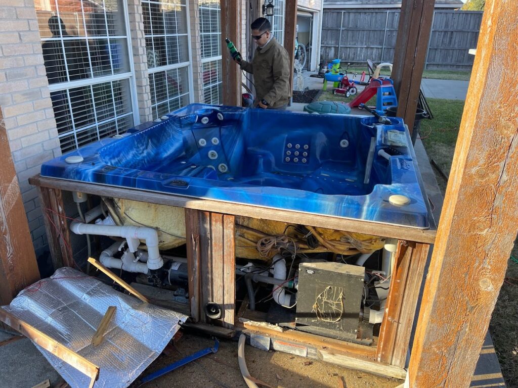 JM junk removers prepping hot tub for removal