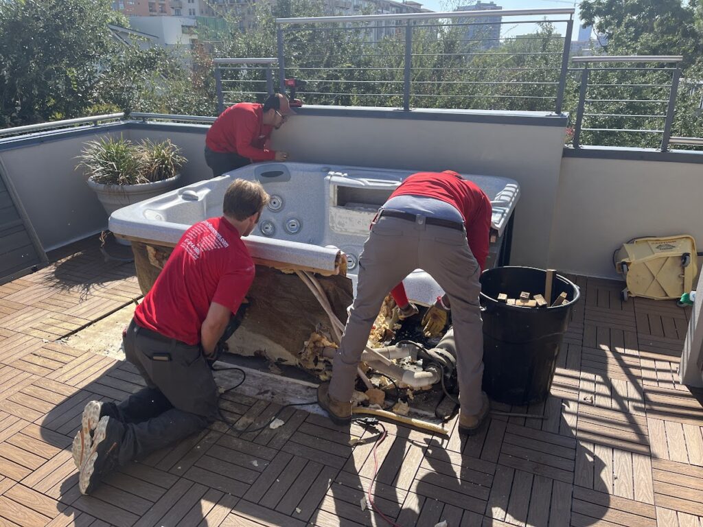 JM junk demolishing hot tub in Carrollton