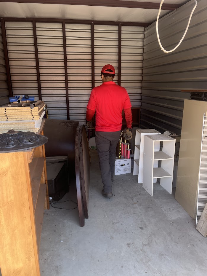 JM junk crew cleaning out storage unit