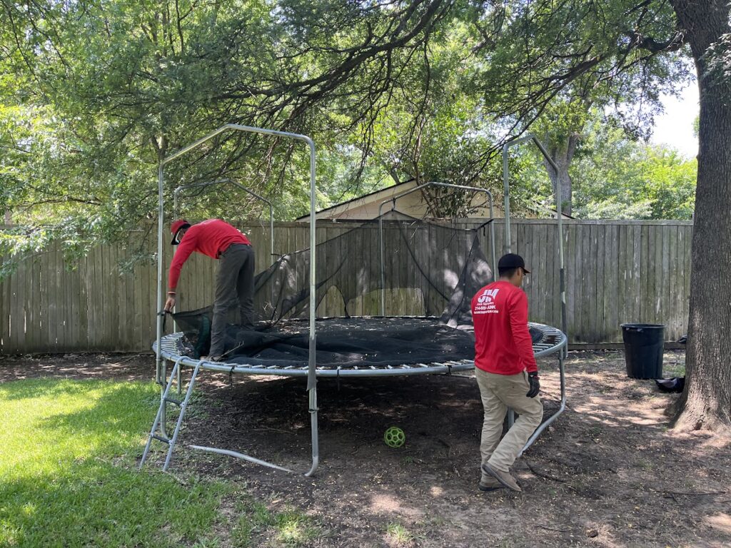 JM junk tearing down trampoline