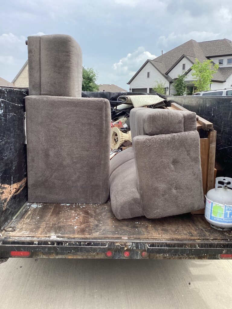 furniture removal loaded in jm junk trailer