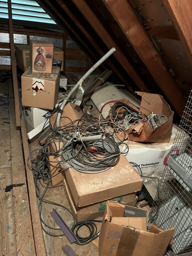 cluttered attic needing attic cleanout services