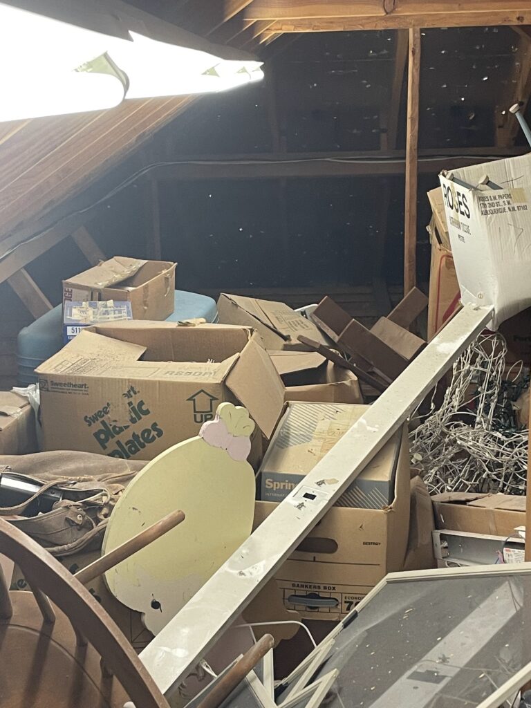 crowded attic needing cleanout services by jm junk