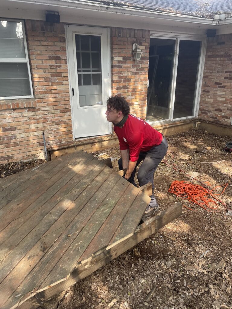 jm junk crew lifting and removing demolished deck