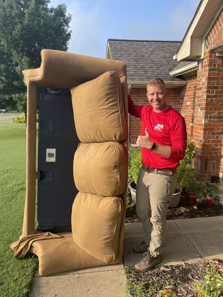 jm junk crew removing couch in furniture removal job