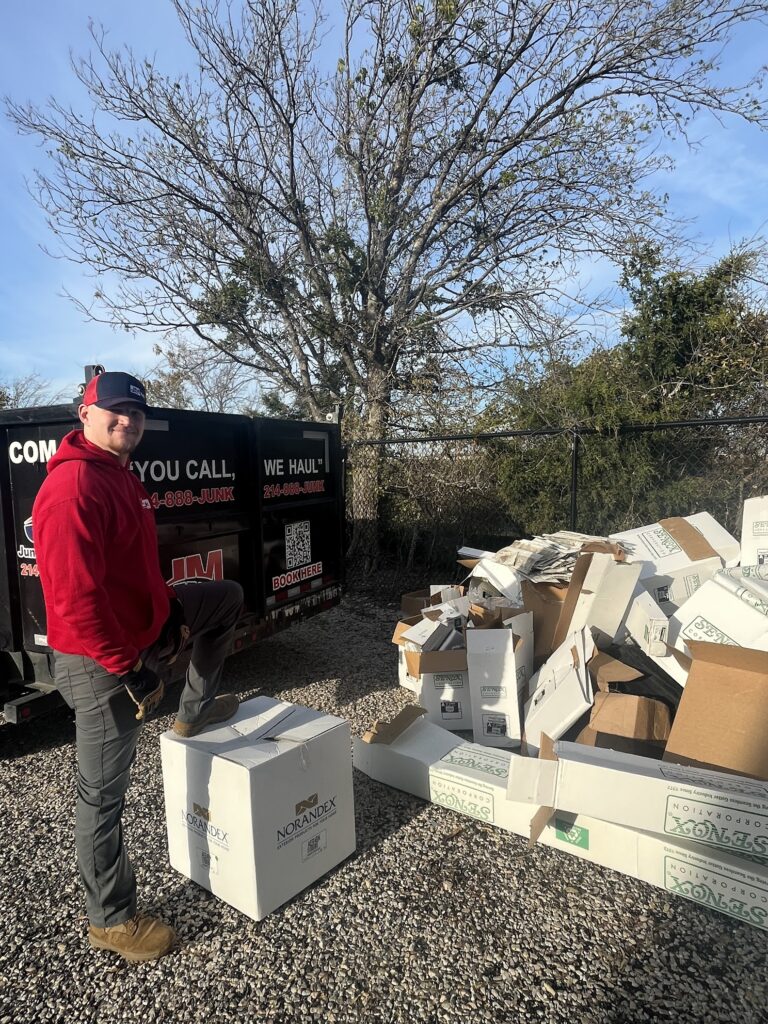 jm junk loading up cardboard boxes into trailer