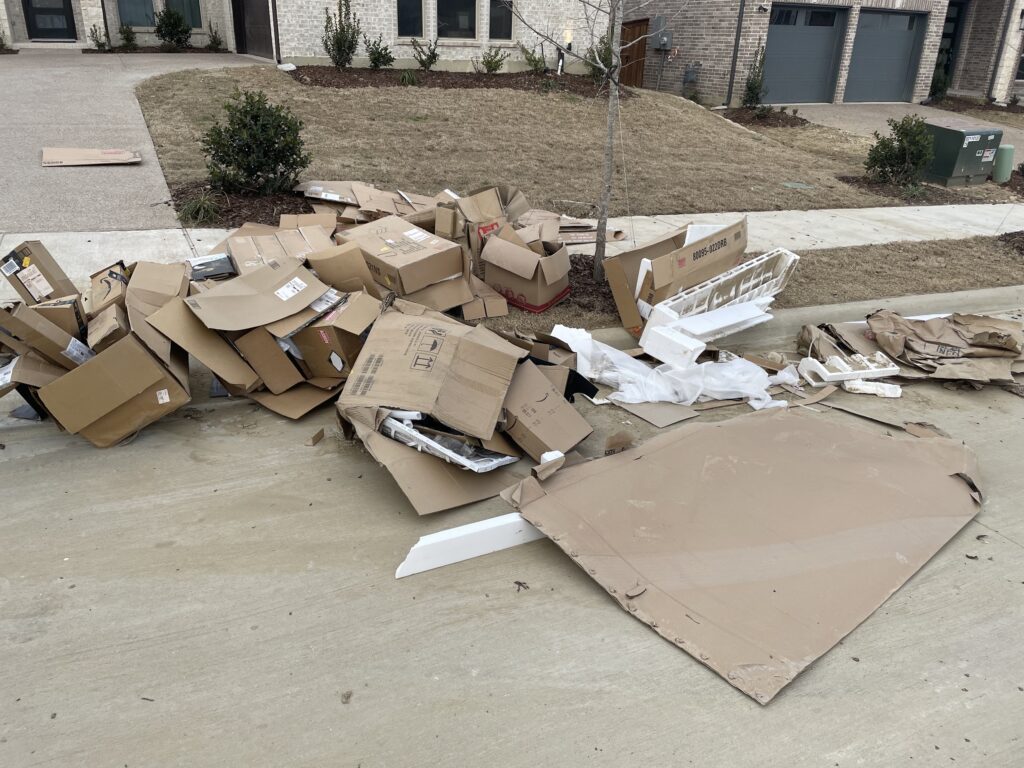 pile of cardboard needing removal