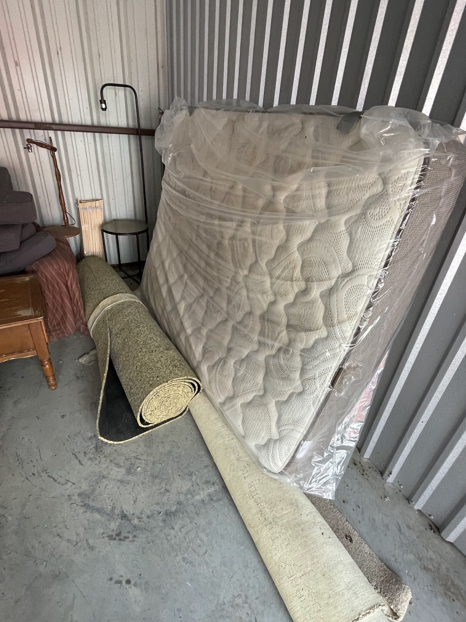 rolled up carpet being moved our of storage