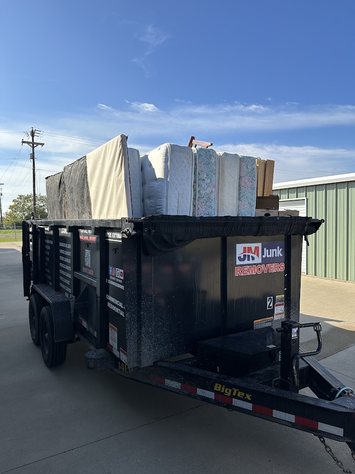 JM junk loaded move out cleanout trailer