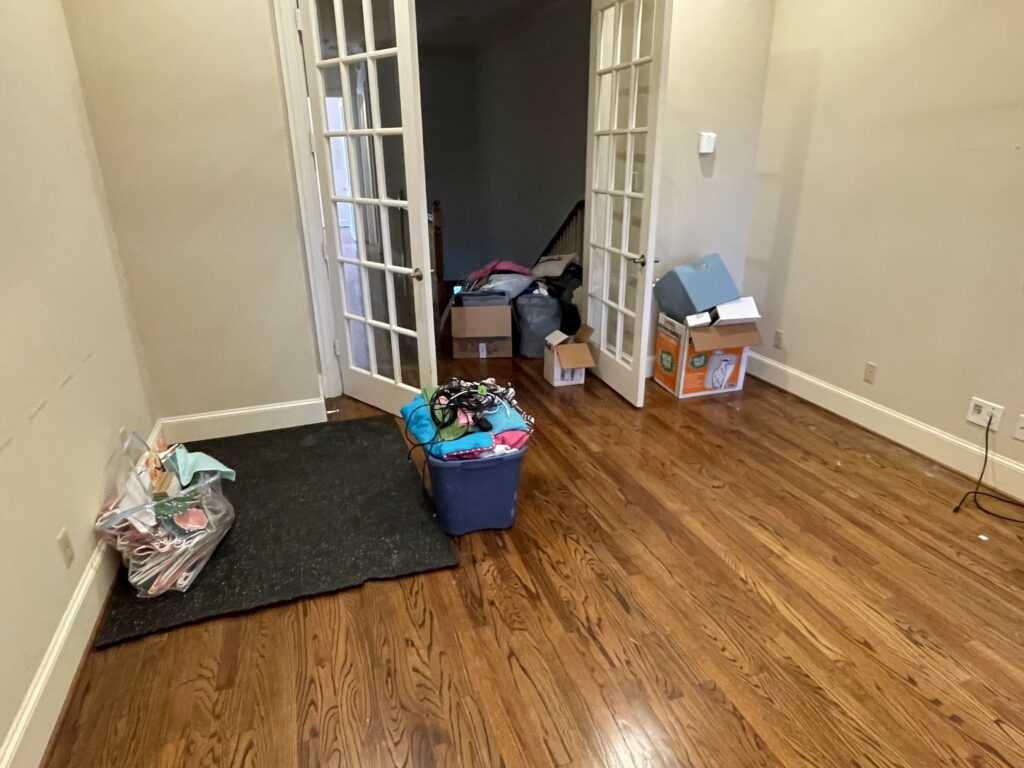 hangers and clothes packed away for foreclosure cleanout