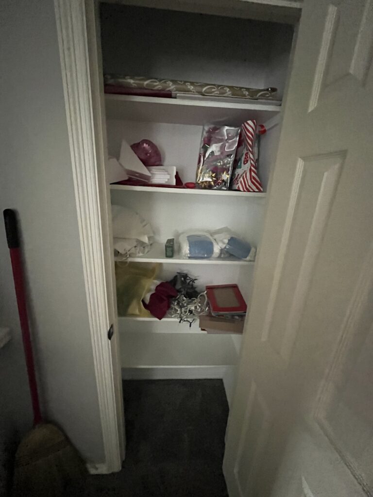 linen closet being cleaned for foreclosure cleanout